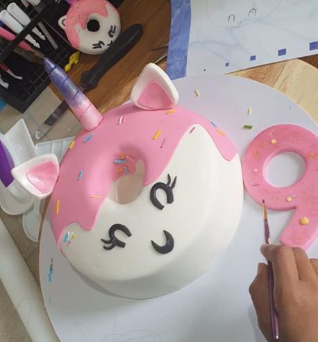 attachment-https://www.amysbakehouse.com.au/wp-content/uploads/2021/11/Donut-Unicorn-Cake-6-458x493.jpg