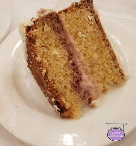 attachment-https://www.amysbakehouse.com.au/wp-content/uploads/2021/11/Lamington-Rasperry-Jam-Panacotta-Cake-3-458x493.jpg