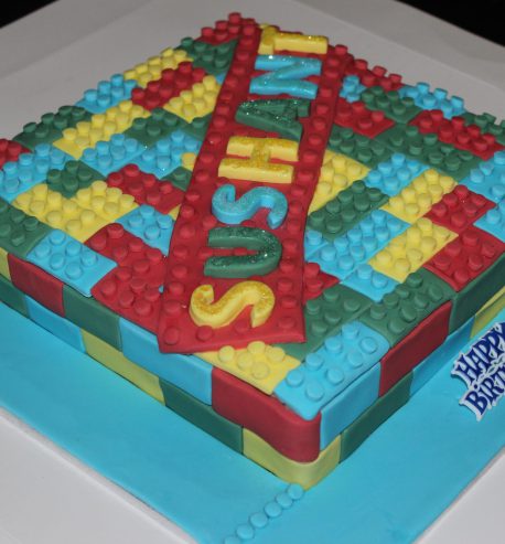 attachment-https://www.amysbakehouse.com.au/wp-content/uploads/2021/11/Lego_Themed_Green_Velvet_Birthday_Cake1-scaled-1-458x493.jpg