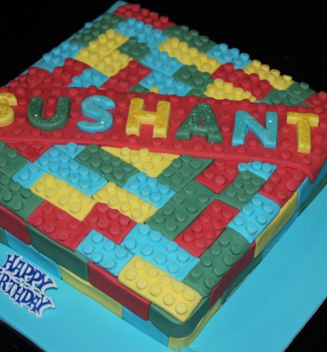 attachment-https://www.amysbakehouse.com.au/wp-content/uploads/2021/11/Lego_Themed_Green_Velvet_Birthday_Cake2-scaled-1-458x493.jpg