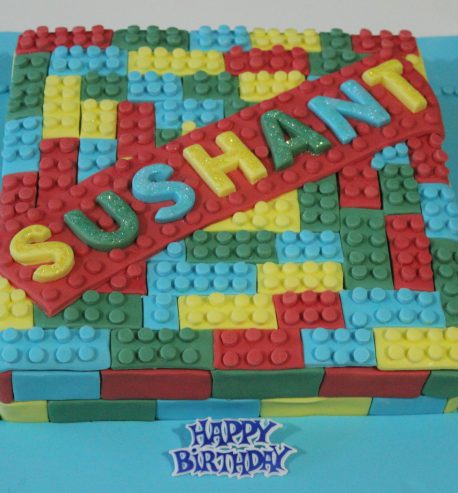 attachment-https://www.amysbakehouse.com.au/wp-content/uploads/2021/11/Lego_Themed_Green_Velvet_Birthday_Cake3-scaled-1-458x493.jpg