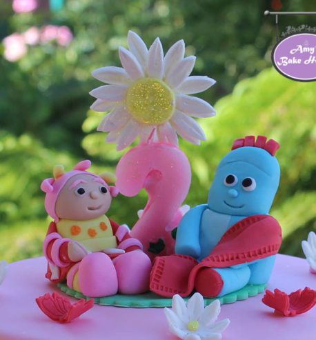 attachment-https://www.amysbakehouse.com.au/wp-content/uploads/2021/11/iggle-piggle-upsy-daisy-in-the-night-garden-birthday-cake-2-458x493.jpg