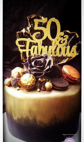 attachment-https://www.amysbakehouse.com.au/wp-content/uploads/2022/02/Black-Gold-Chocolate-Themed-Cake-292x493.jpg