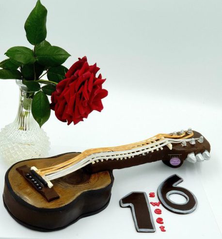 attachment-https://www.amysbakehouse.com.au/wp-content/uploads/2022/02/Guitar-Shape-Chocolate-Cake1-458x493.jpg